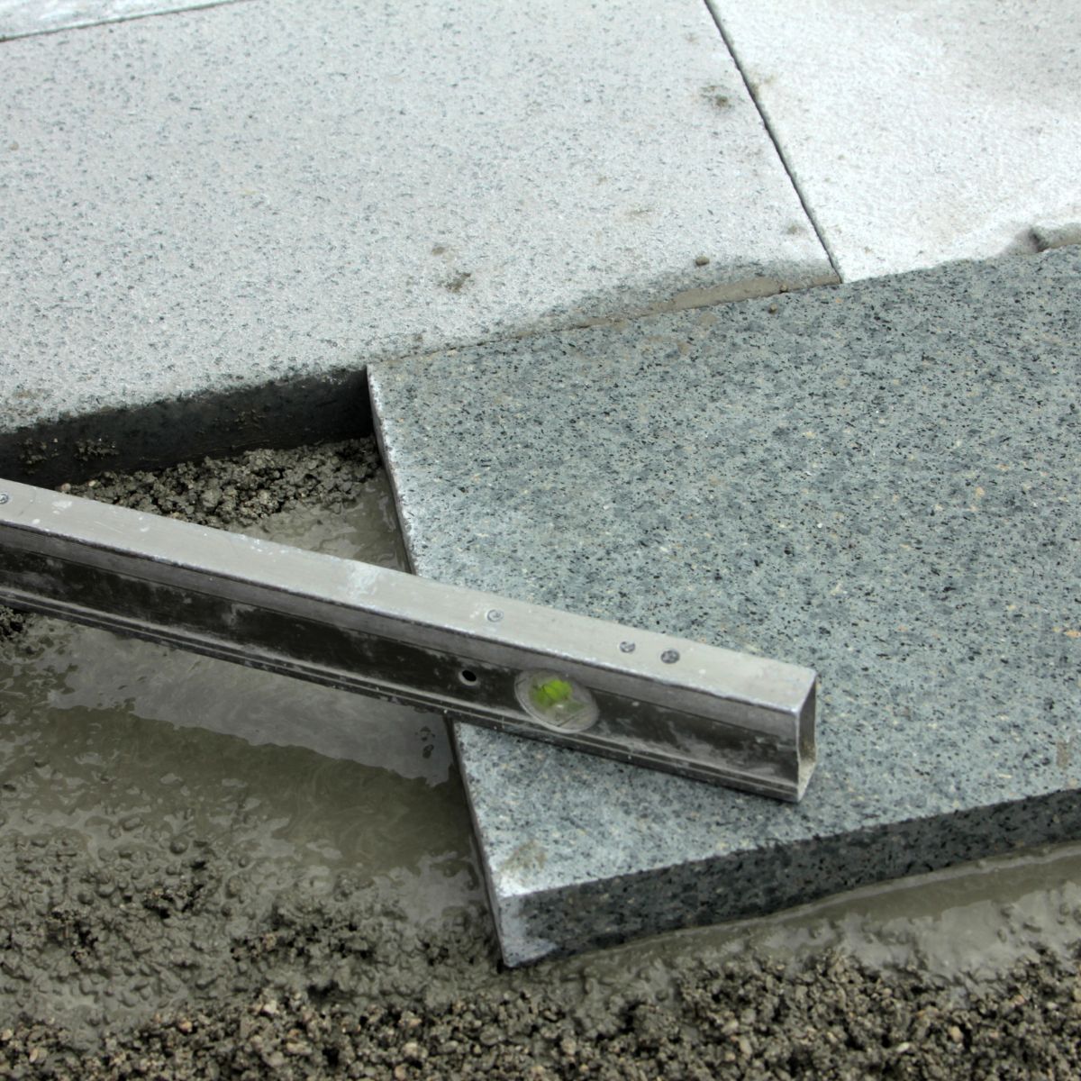 How to Lay Paving Slabs on Concrete - Oxcrete